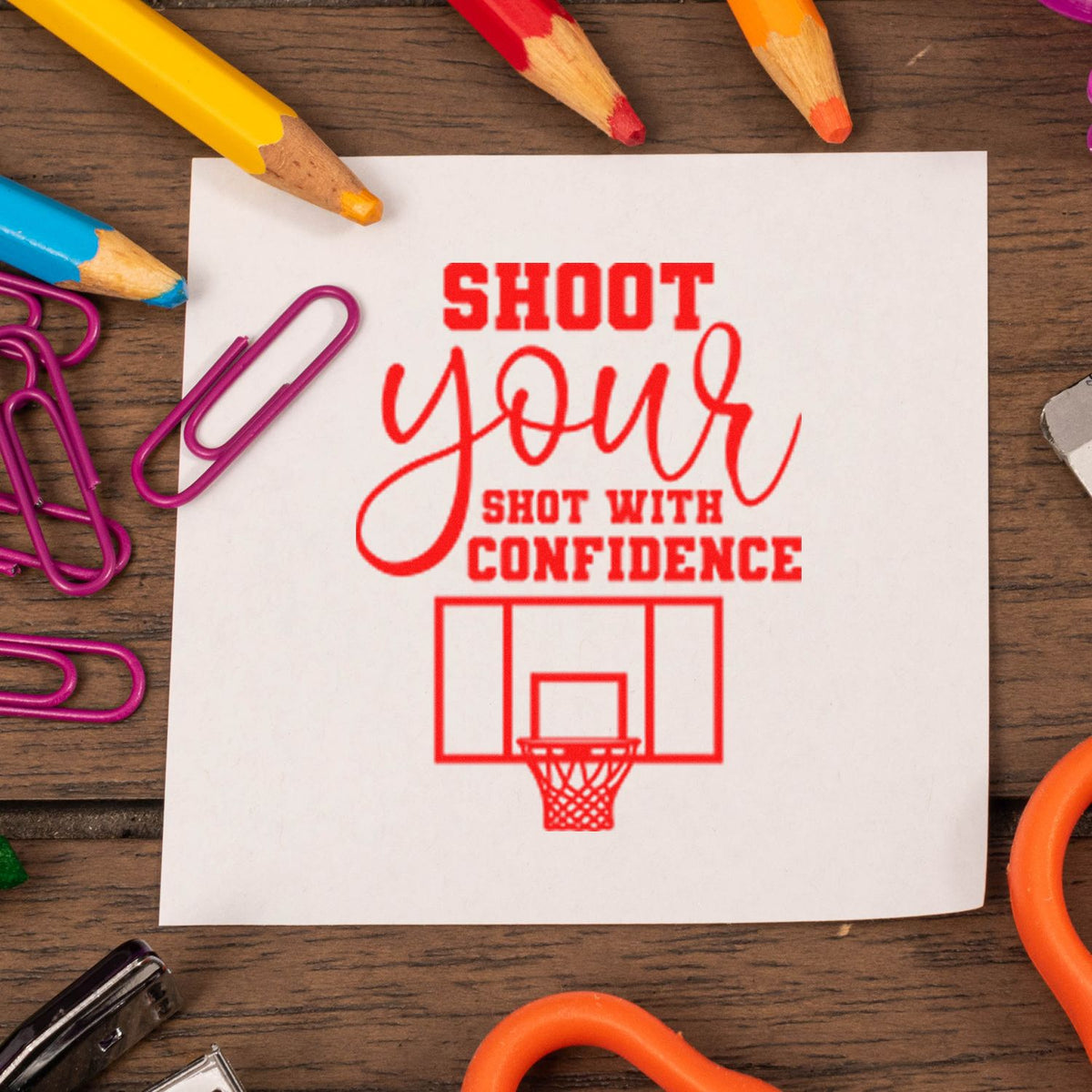 Shoot Shot With Confidence rubber stamp shown in red ink, stamped for projects such as halftime album page.