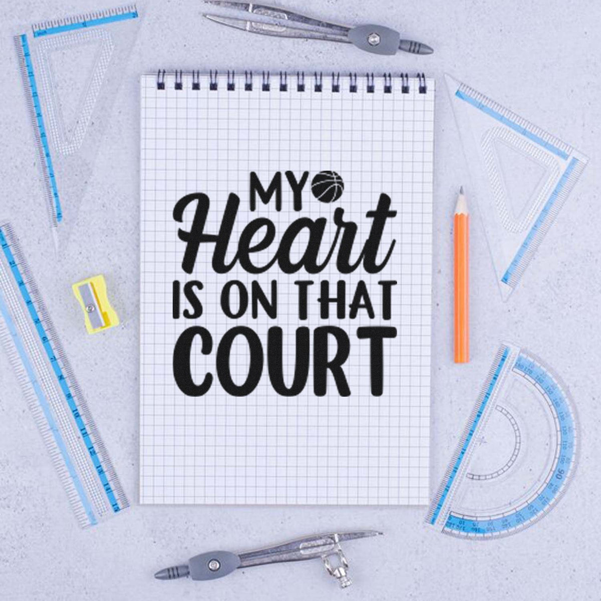 Basketball court rubber stamp design reading My Heart Is on That Court on a notebook, ideal for sports-themed stationery.