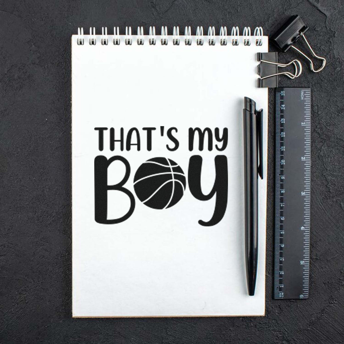 Basketball-themed rubber stamp reading Thats My Boy on notebook, perfect for sports crafts and personalized projects.