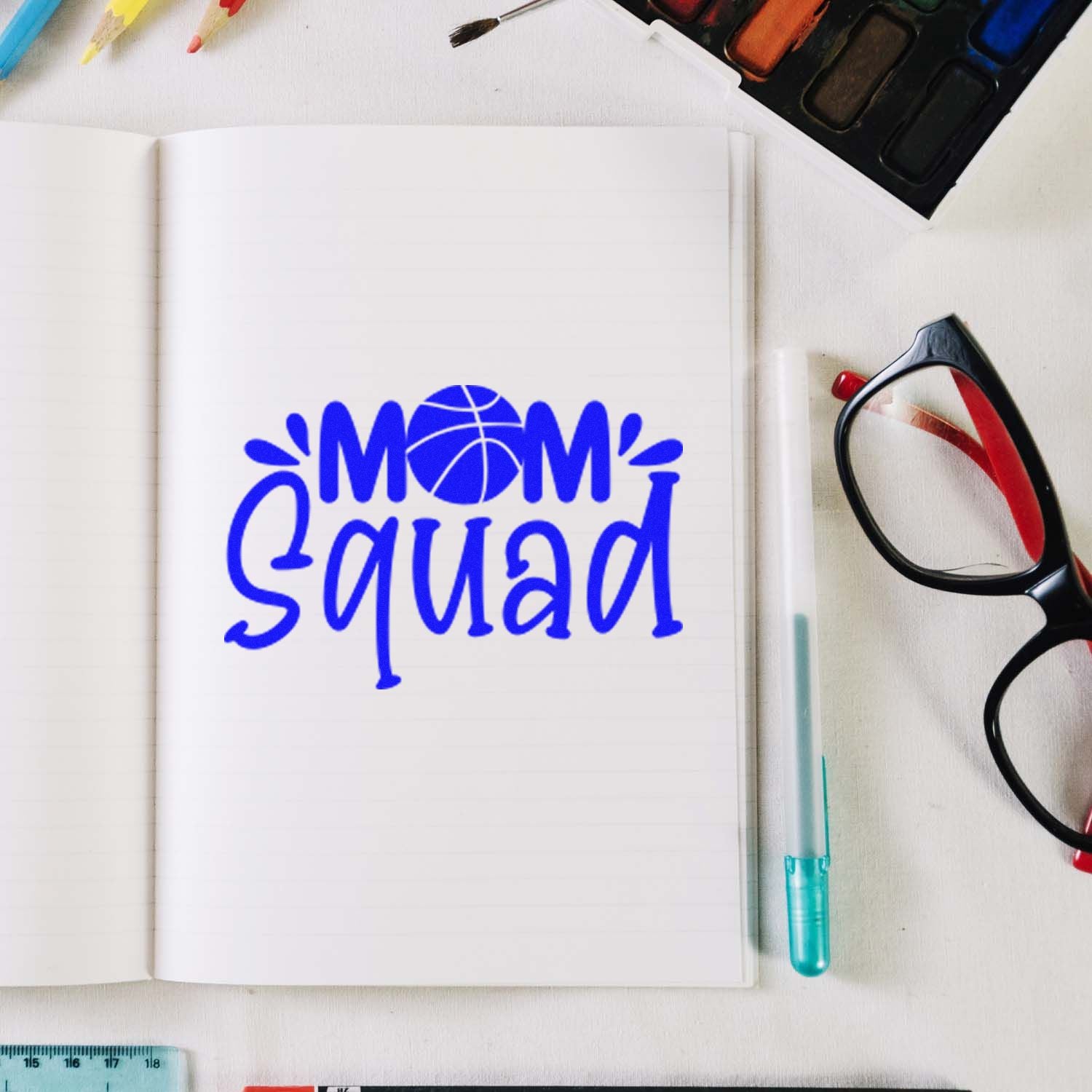 Custom Mom Squad rubber stamp impression on notebook, ideal for basketball mom crafts, planners, and scrapbooking.
