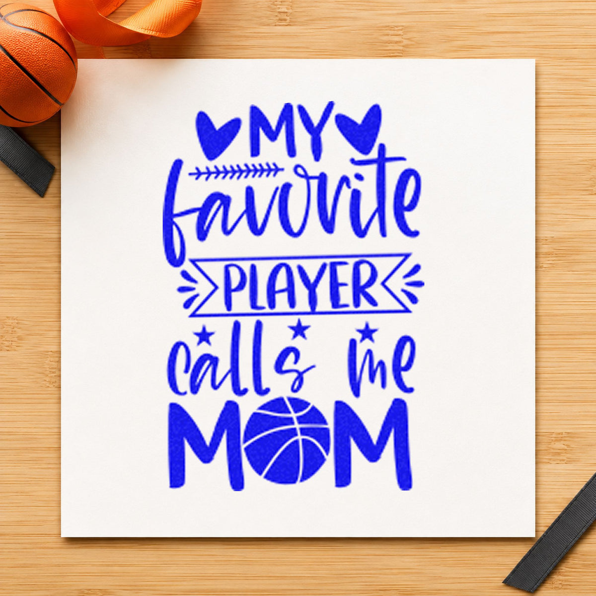 Favorite Player Calls Mom craft stamp imprinted in blue ink on paper, a design suited to framed hall gallery.