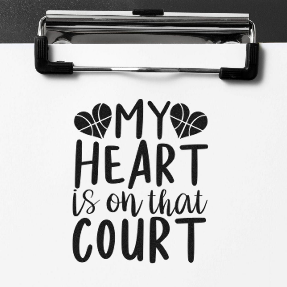 Basketball rubber stamp design reading My Heart Is on That Court with heart basketball icons, ideal for sports-themed crafts.