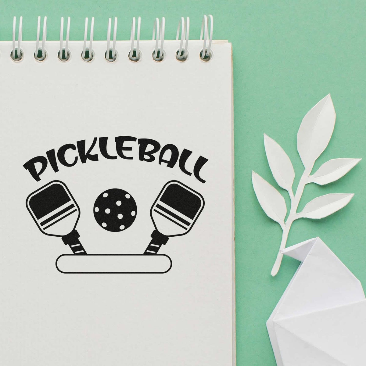 Custom pickleball rubber stamp design with paddles and ball for sports crafts, branding, and stationery.