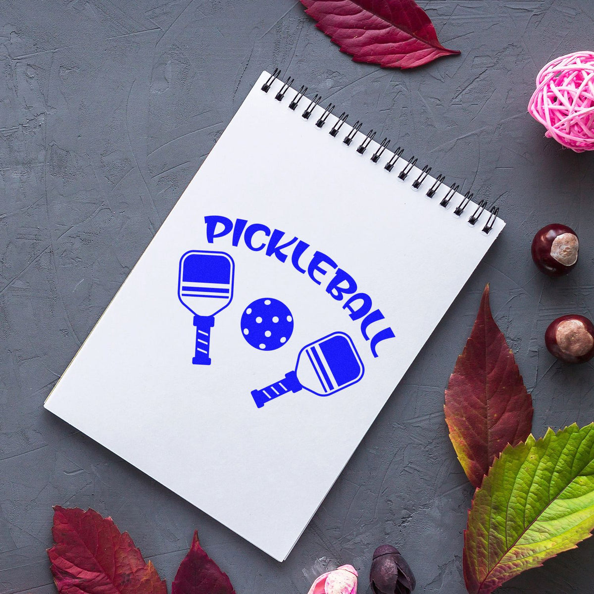 Pickleball rubber stamp design with paddles and ball, ideal for custom sports crafts, branding, and stationery.