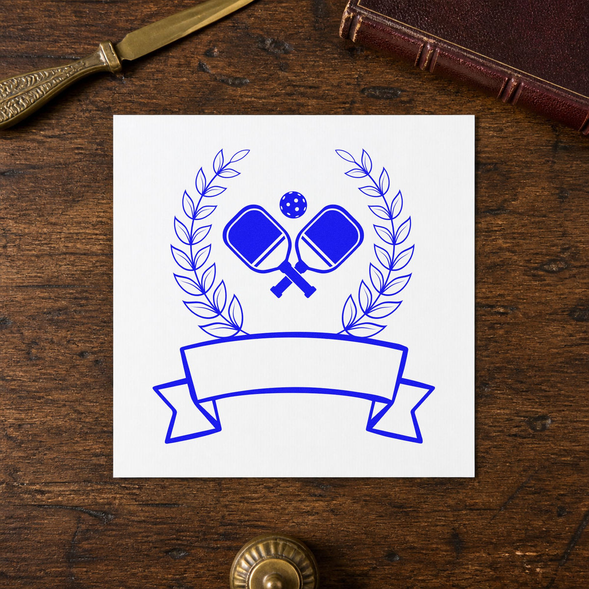 Pickleball Laurel Blank Ribbon craft stamp in blue ink on cardstock, an easy option for court banner printing.