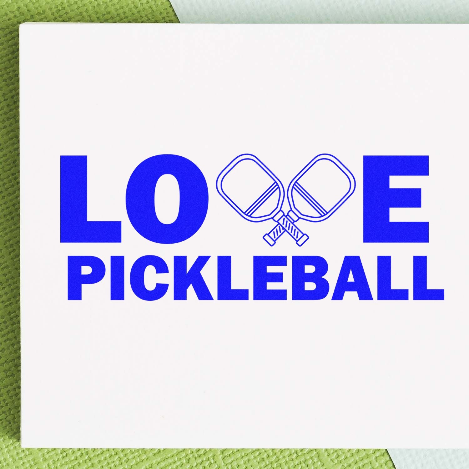 Love pickleball rubber stamp design in blue with crossed paddles, ideal for custom sports stationery and gifts.