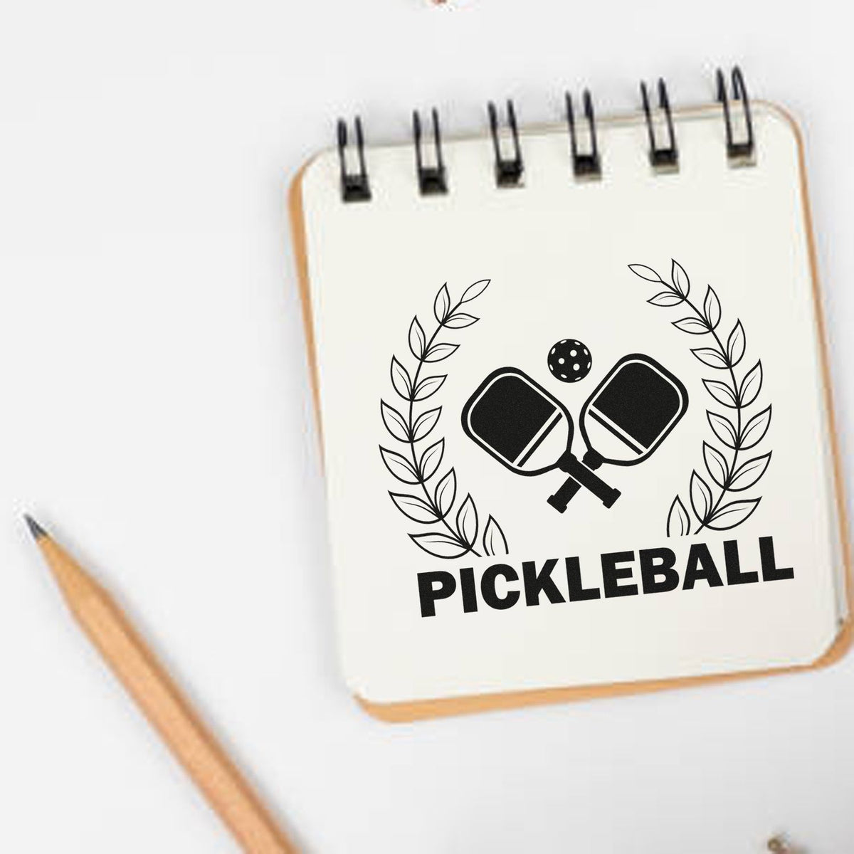 Custom pickleball rubber stamp design with paddles and laurel wreath for sports-themed stationery and crafts