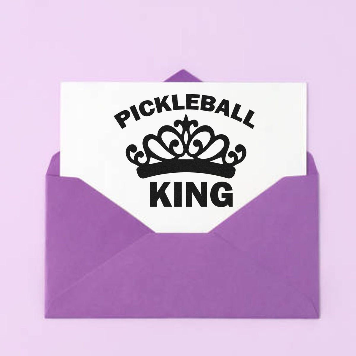 Personalized Pickleball King rubber stamp with crown on a purple envelope