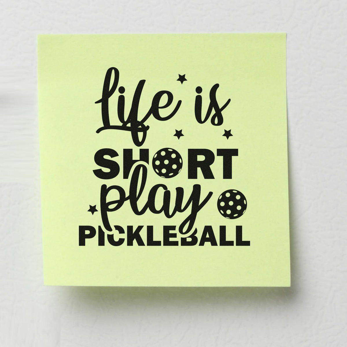 Pickleball rubber stamp design with life is short, play pickleball quote and ball icons on a lime note.