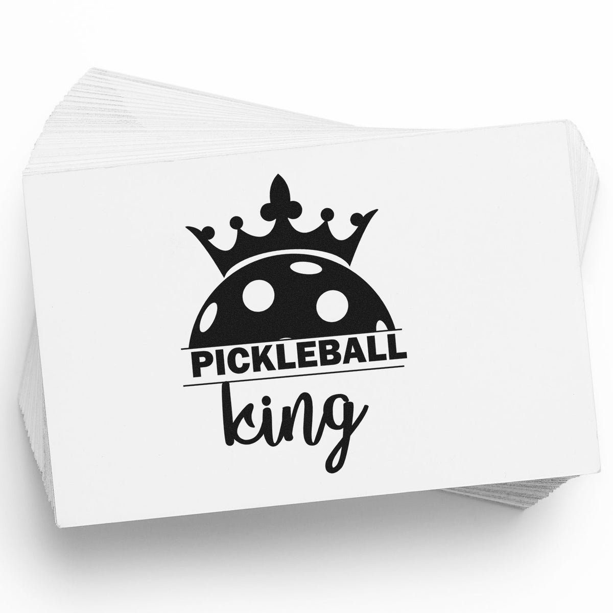 Custom Pickleball King rubber stamp with crown and pickleball graphic on stacked white cards