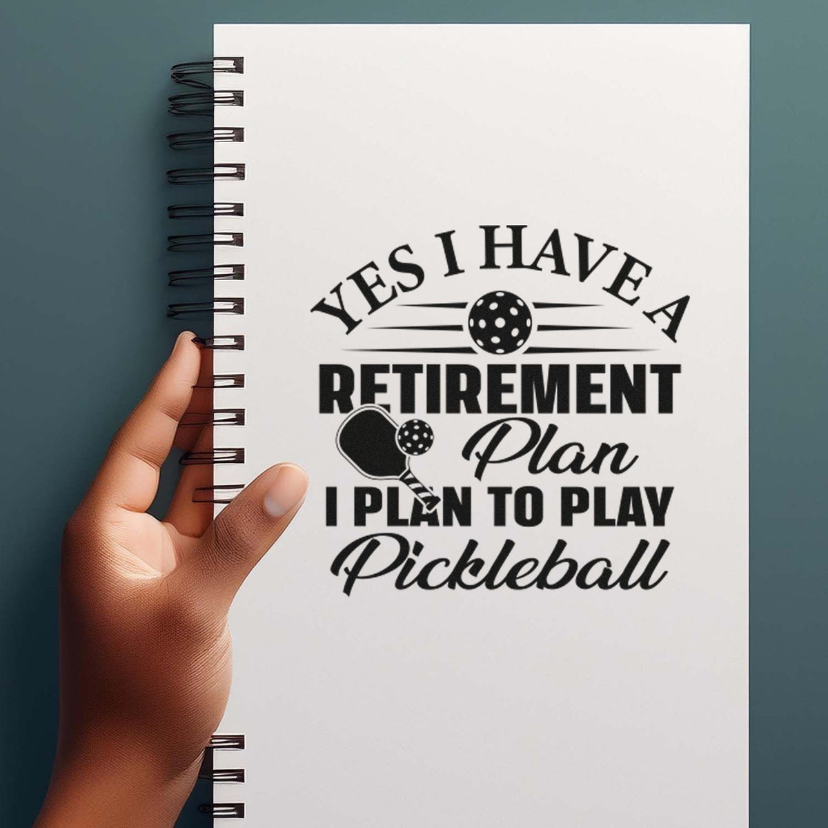 Pickleball retirement plan rubber stamp design on notebook with text: Yes I have a retirement plan, I plan to play pickleball.