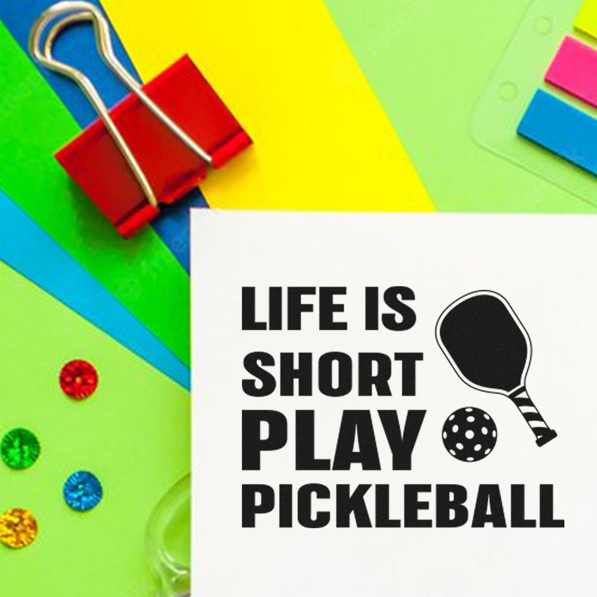 Custom pickleball rubber stamp with Life Is Short Play Pickleball message and paddle graphic on colorful stationery.