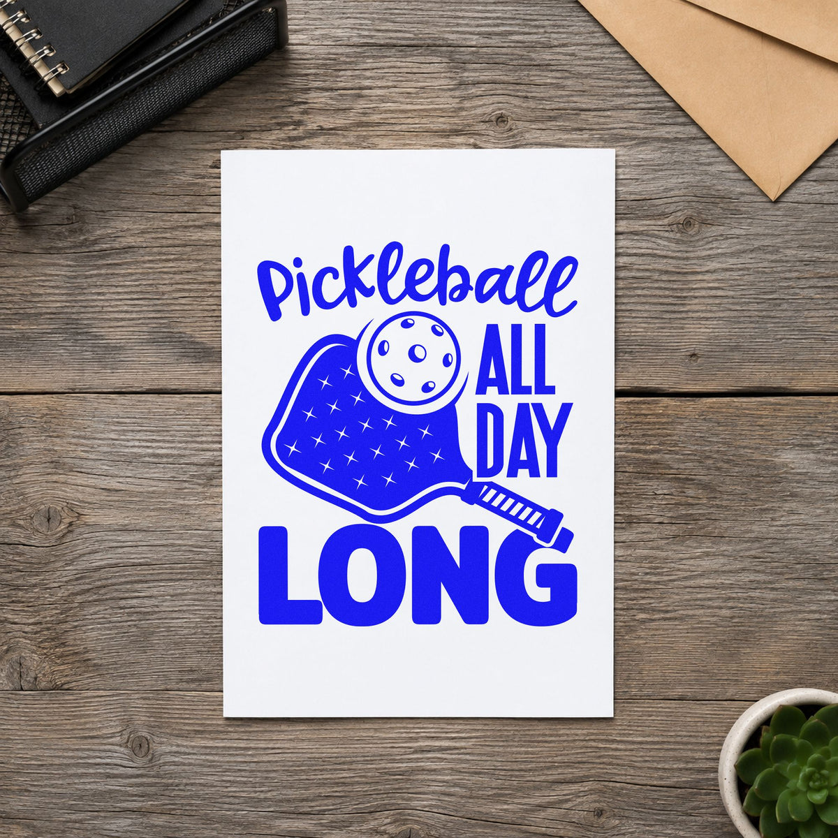 Pickleball All Day Long craft stamp in blue ink on cardstock, an easy option for court flag printing.
