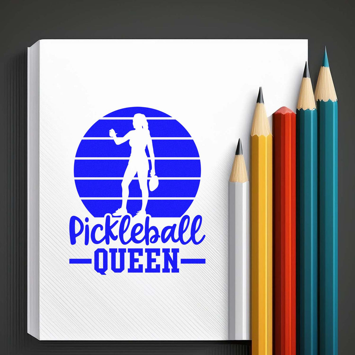 Pickleball Queen rubber stamp design with blue female silhouette, perfect for custom sports crafts and stationery.