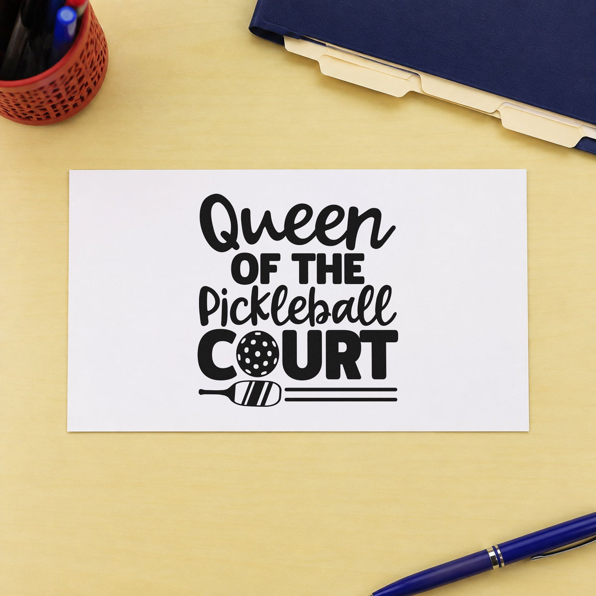 Queen Of Pickleball Court craft stamp imprint in black ink on a handmade project, one idea being gift basket tags.