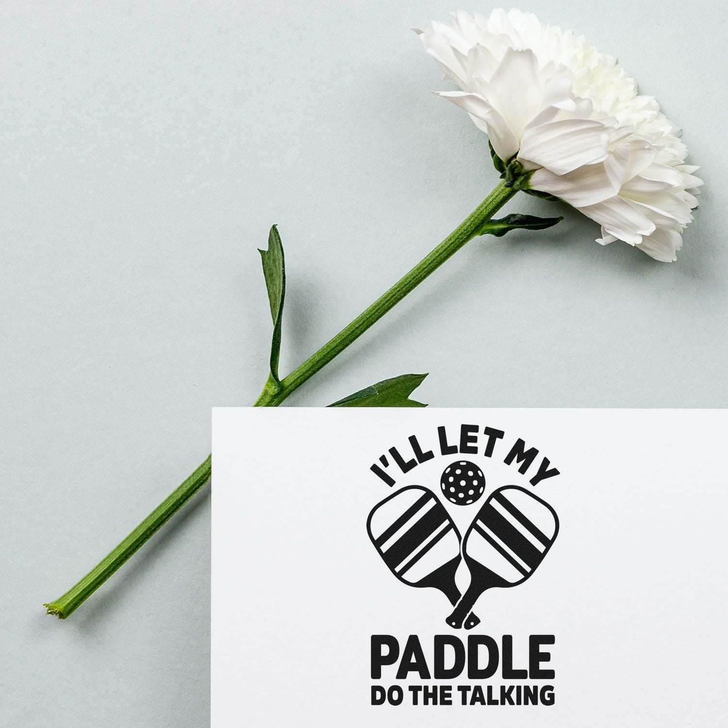 Pickleball rubber stamp design reading Ill let my paddle do the talking with crossed paddles and heart icon.