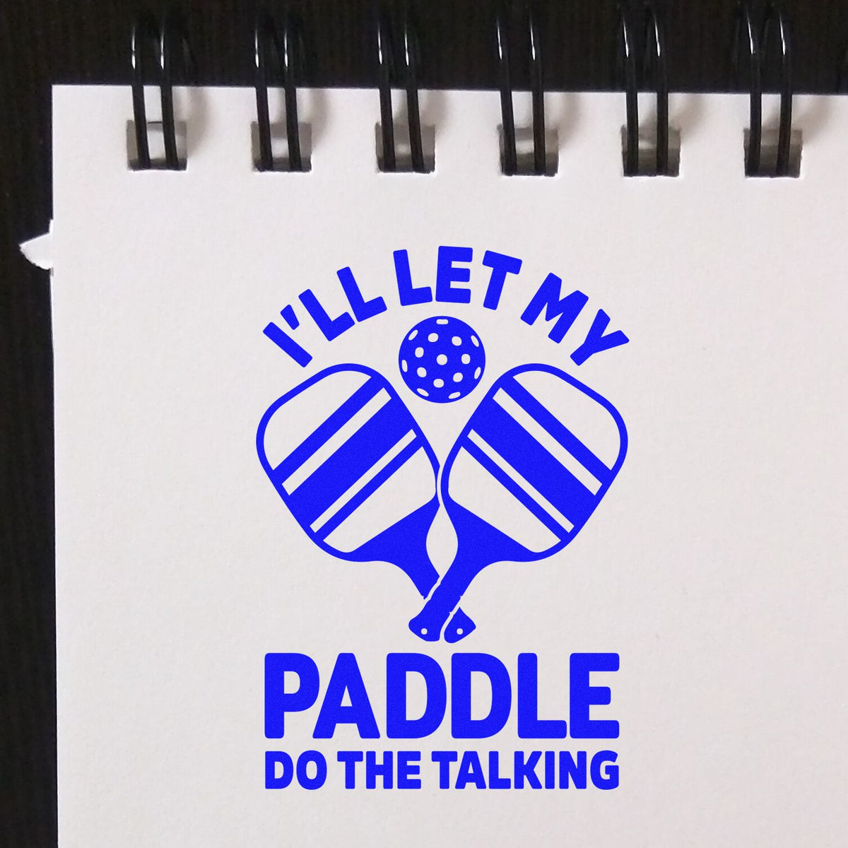 Custom pickleball rubber stamp design with slogan Ill let my paddle do the talking and crossed paddles.