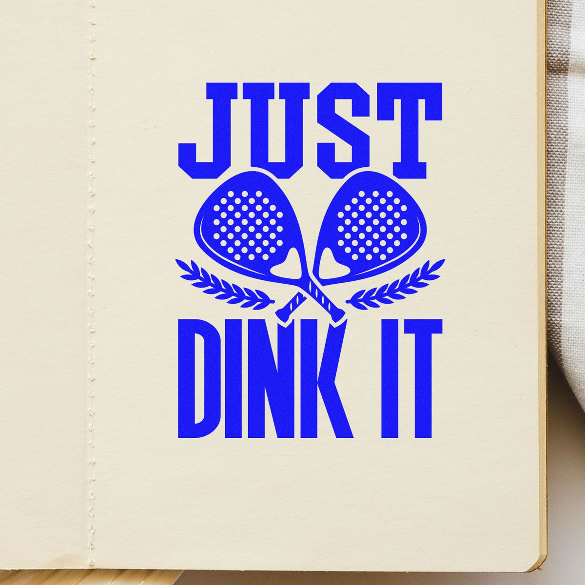 Pickleball rubber stamp design reading Just Dink It with crossed paddles, ideal for sports crafts and custom stationery.