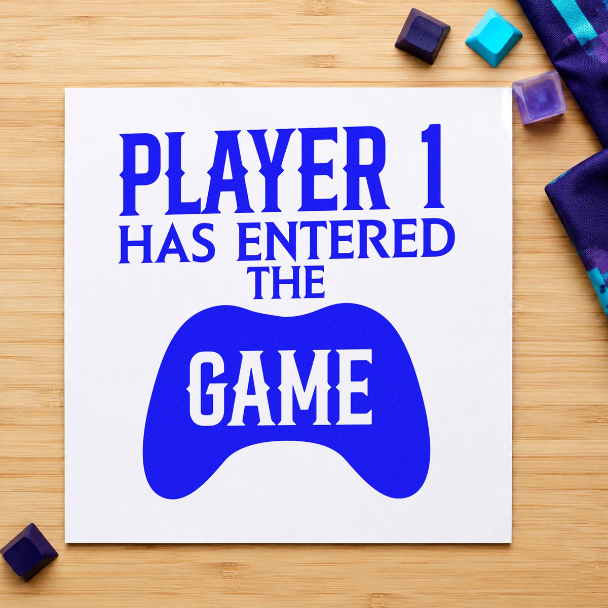 Player One Entered Game craft stamp imprinted in blue ink on paper, a design suited to framed nursery shelf.
