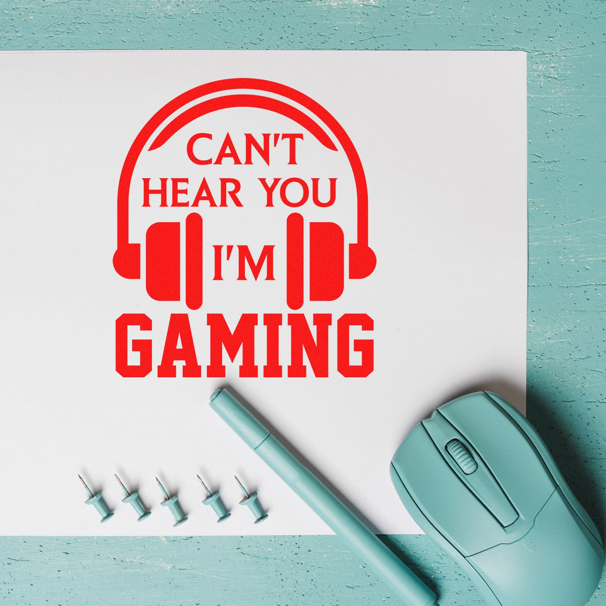 Custom gamer rubber stamp design with headset icon and Cant Hear You, Im Gaming text on a white sheet.