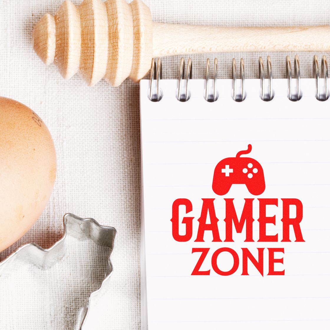 Custom Gamer Zone rubber stamp design with game controller icon for gaming-themed crafts, invitations, and packaging.