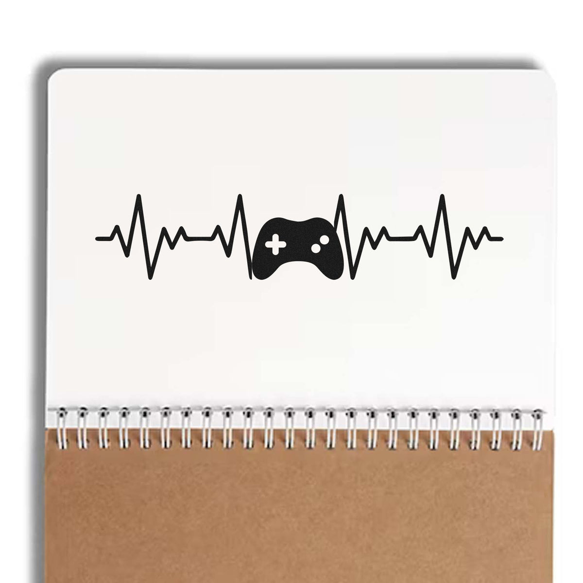 Custom rubber stamp design with heartbeat line and game controller icon on notebook cover for gamer-themed branding.