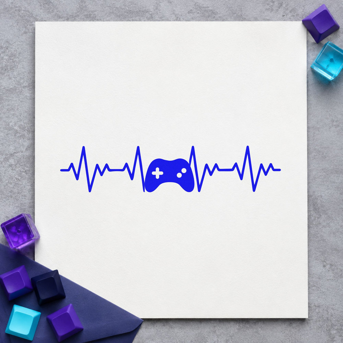 Game Controller Heartbeat Line craft stamp in blue ink on cardstock, an easy option for staff tee printing.