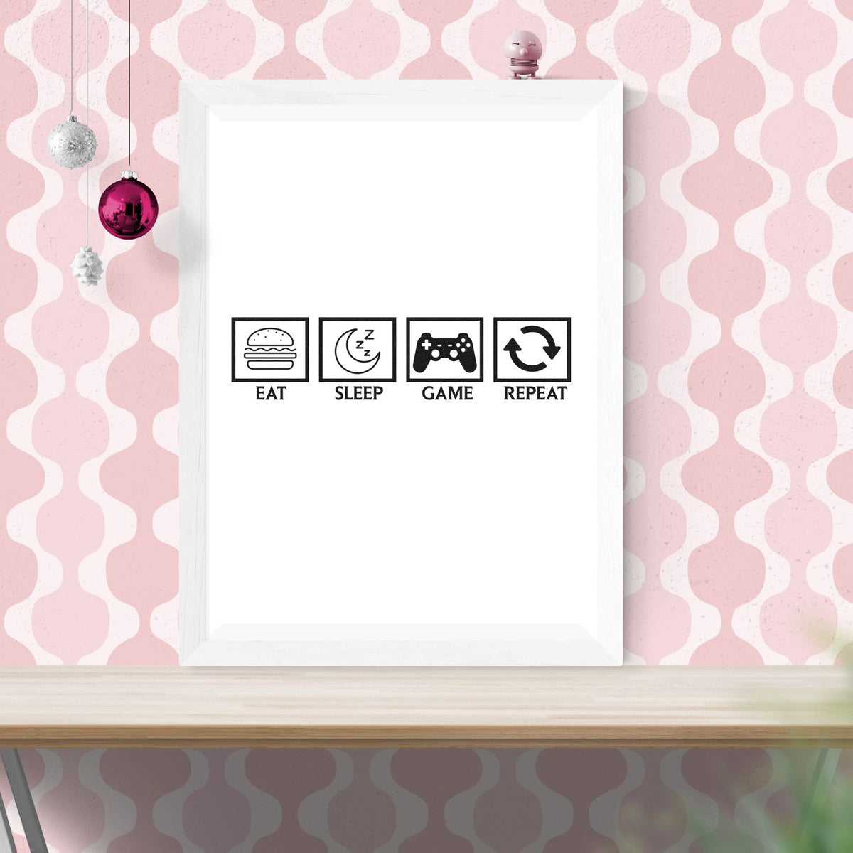 Custom rubber stamp design mockup featuring Eat Sleep Game Repeat icons for a game room framed print.