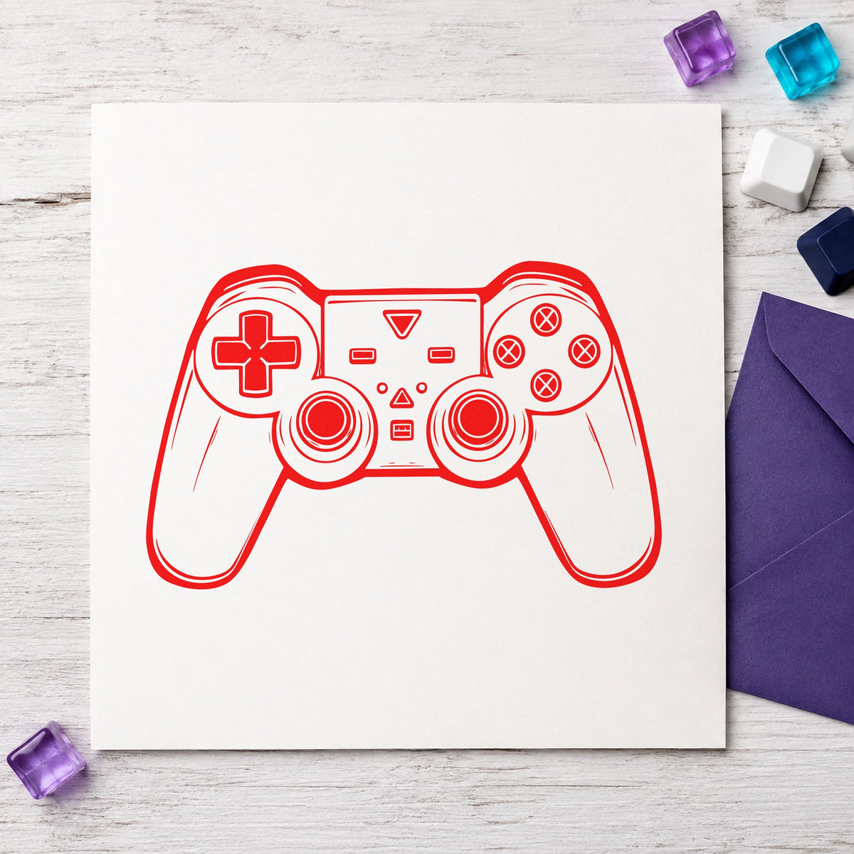 Detailed Dual Stick Controller craft stamp imprint in red ink on a handmade project, one idea being repair note cards.