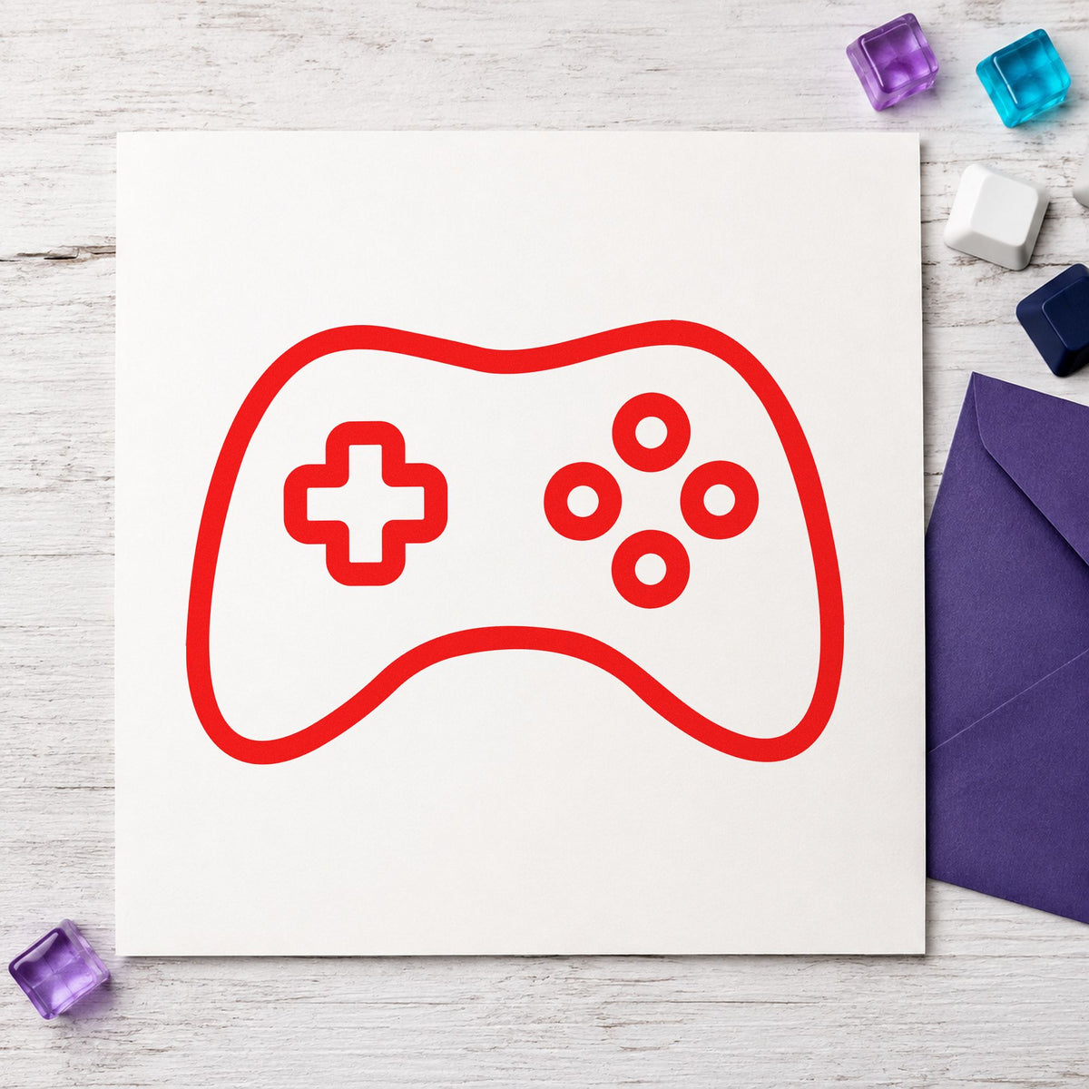 Simple Outlined Game Controller rubber stamp shown in red ink, stamped for projects such as shelf title labels.