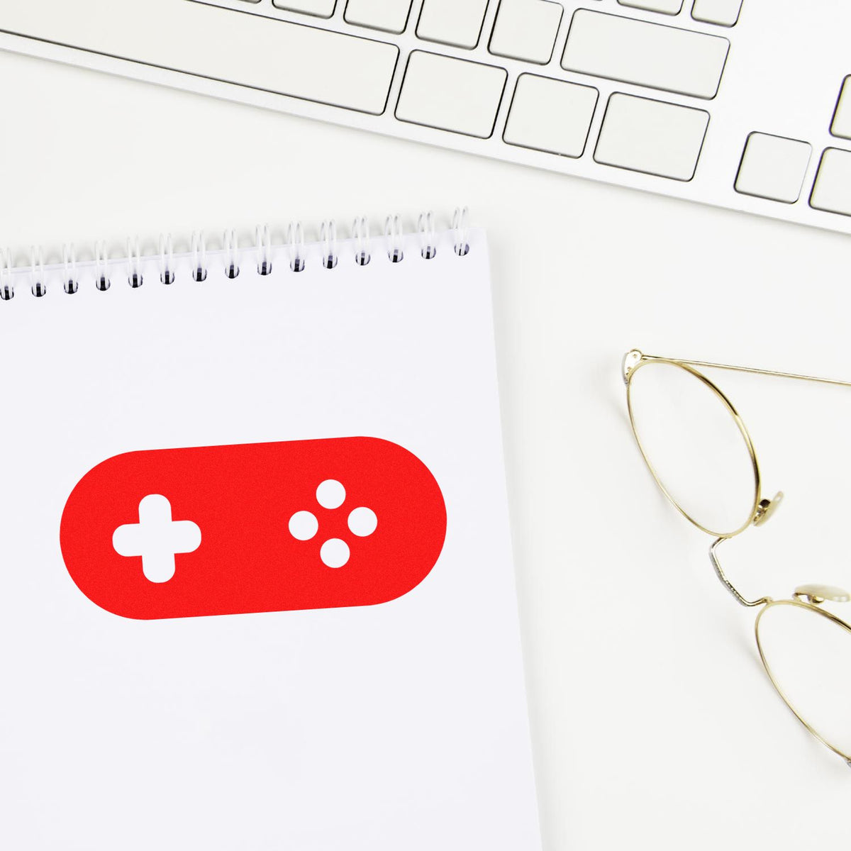 Custom rubber stamp mockup with red pill icon on notebook, ideal for healthcare or pharmacy branding.
