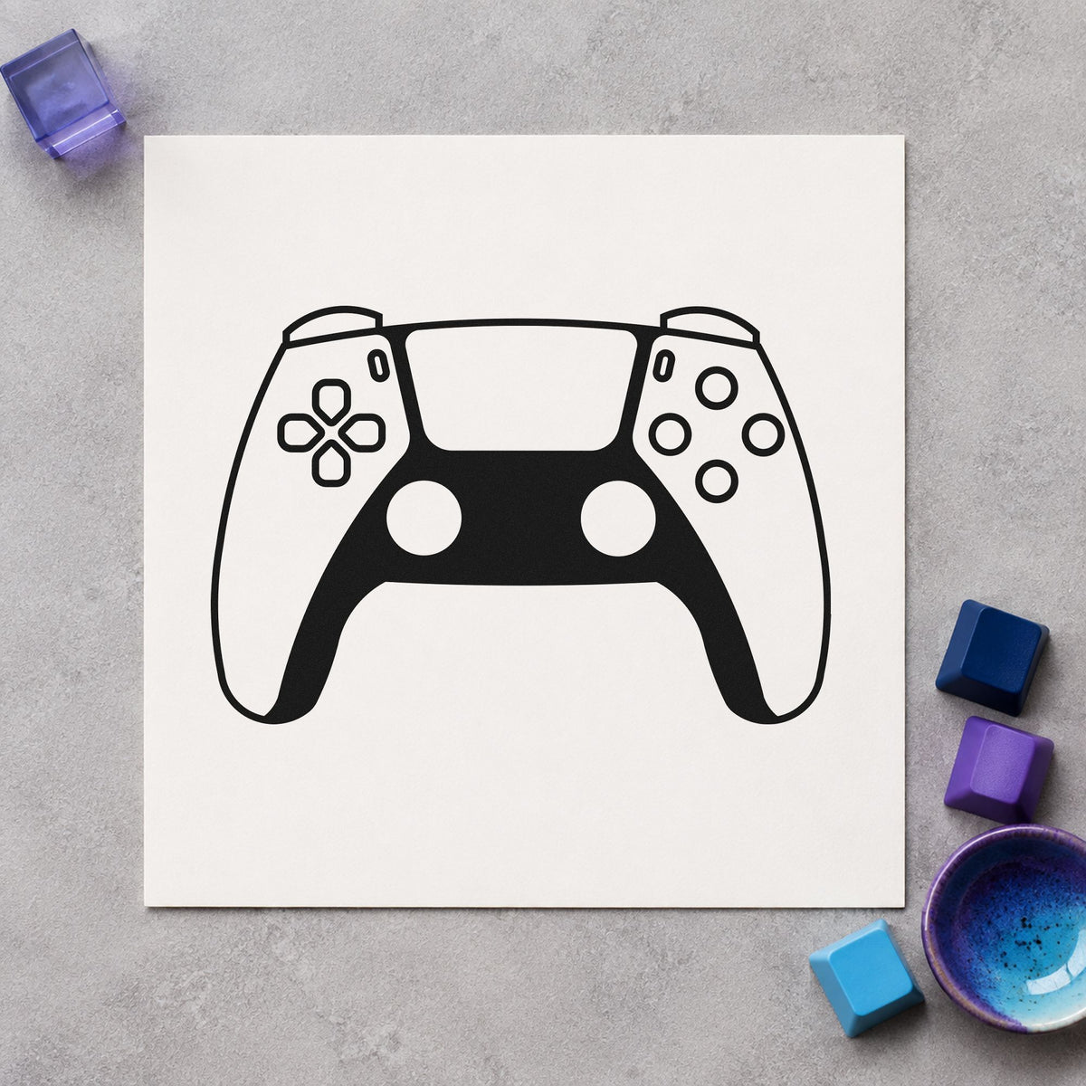 Modern Two Tone Controller craft stamp imprint in black ink on a handmade project, one idea being review unit tags.