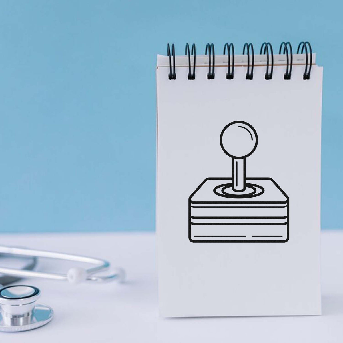 Rubber stamp icon on notepad mockup with stethoscope, ideal for custom medical office stamp branding.