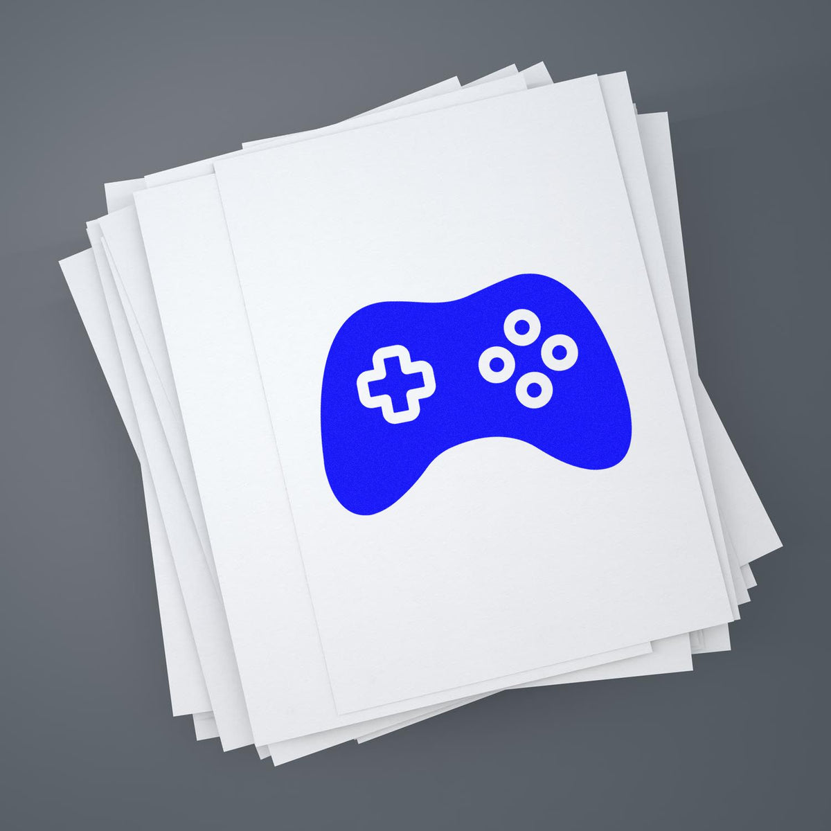 Custom game controller rubber stamp design on stacked paper for branding, packaging, or stationery.
