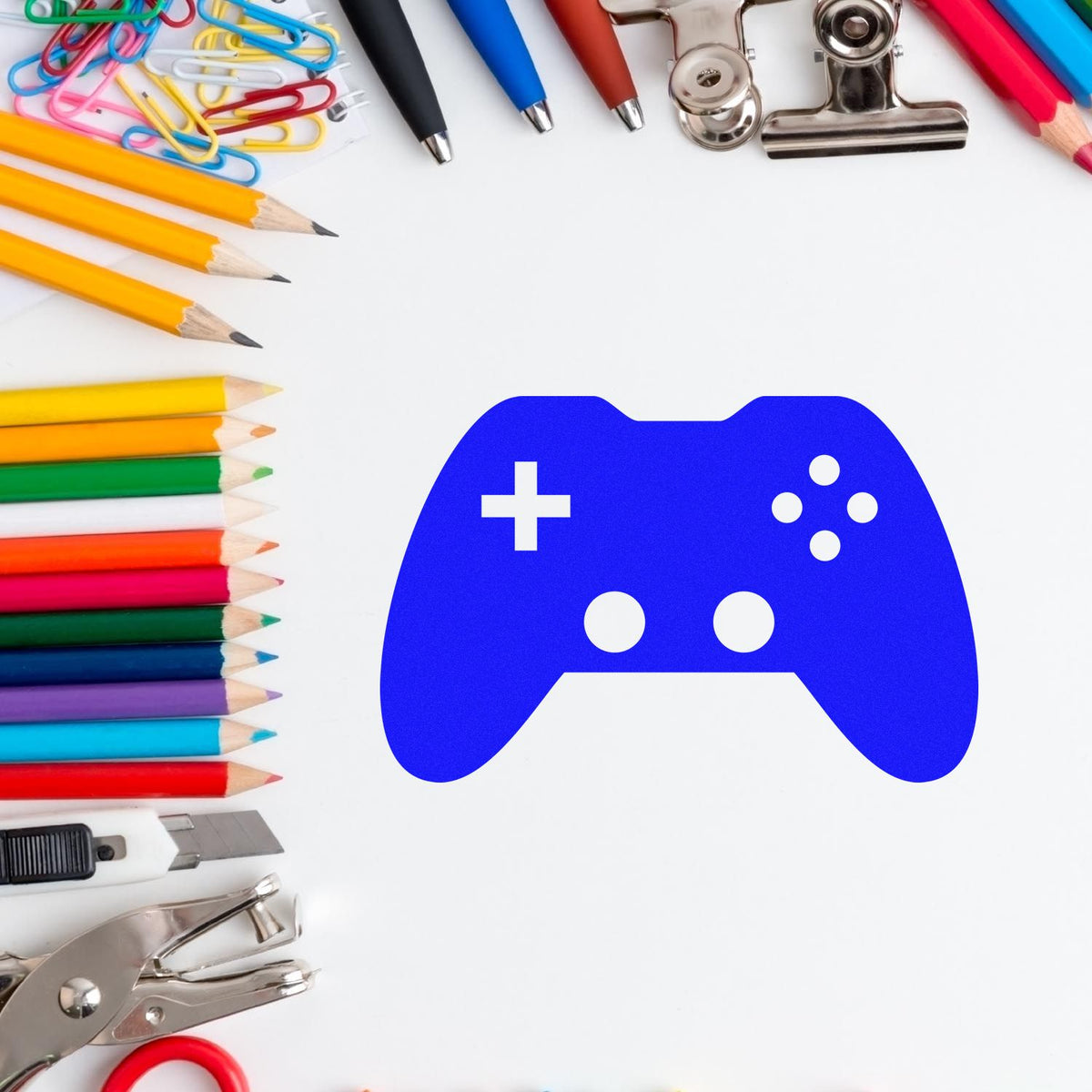 Custom gaming rubber stamp with blue video game controller icon, framed by stationery, for gamer branding and packaging.