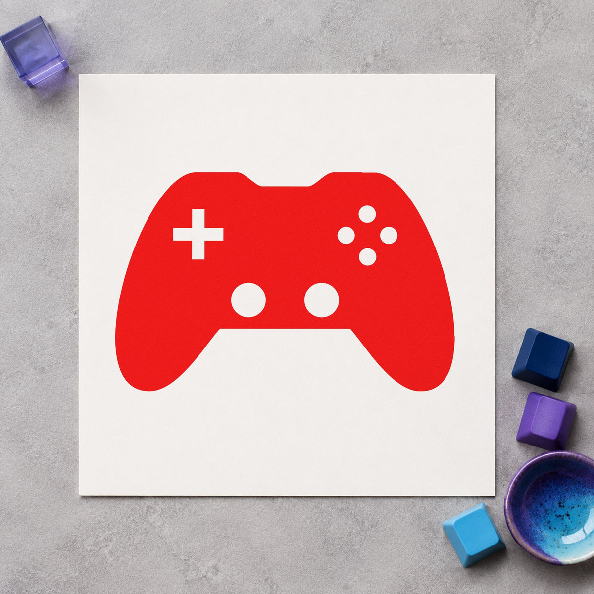Solid Dual Stick Controller craft stamp imprint in red ink on a handmade project, one idea being event info cards.