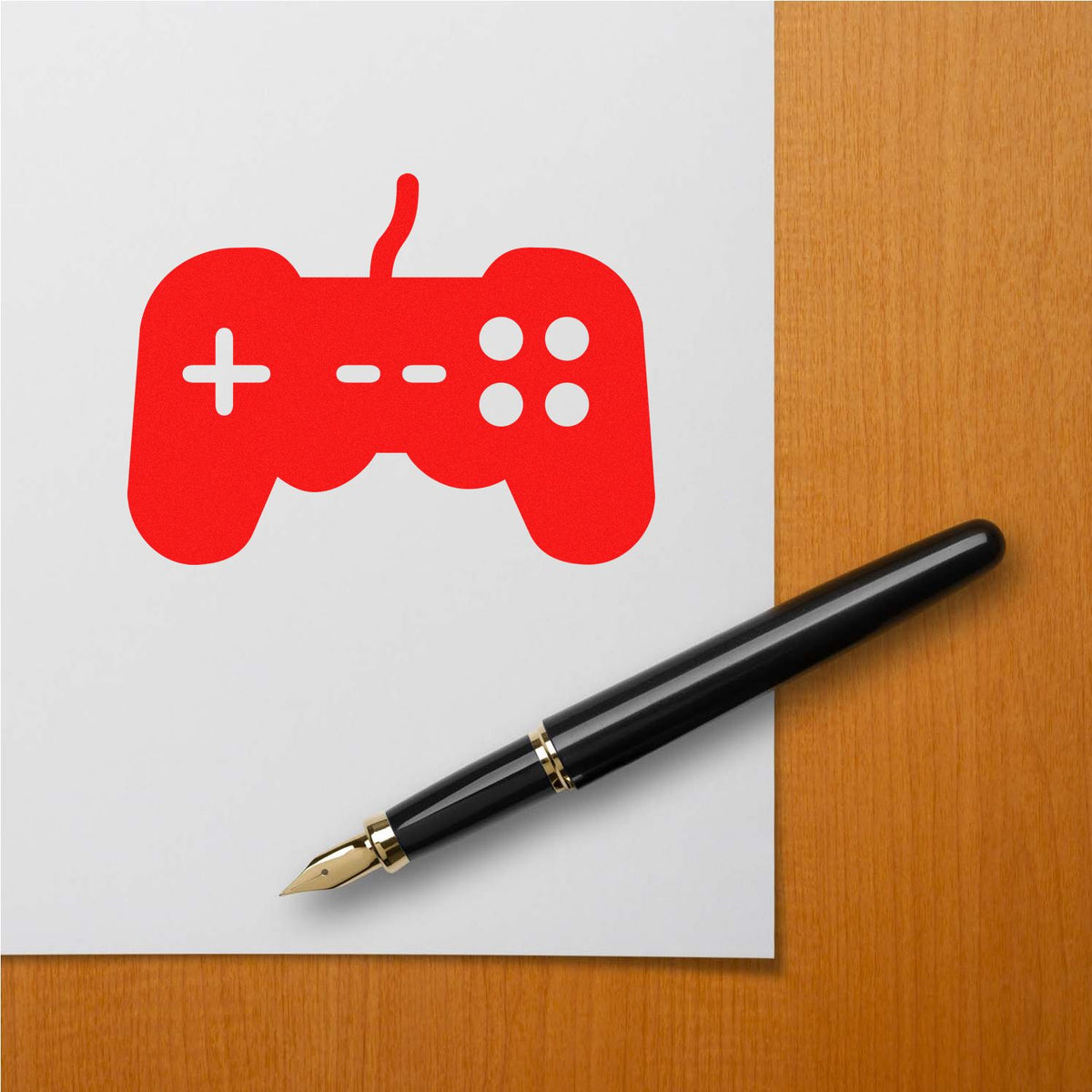 Custom rubber stamp with red gaming controller icon, ideal for game-themed branding, stationery, and creative office use.