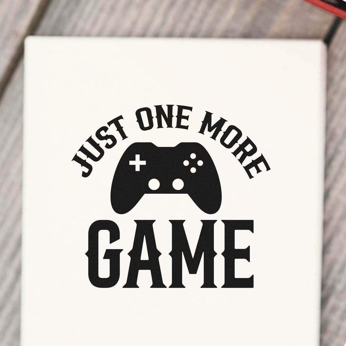 Gaming rubber stamp design with Just One More Game and controller icon for gamer crafts and custom stamping.