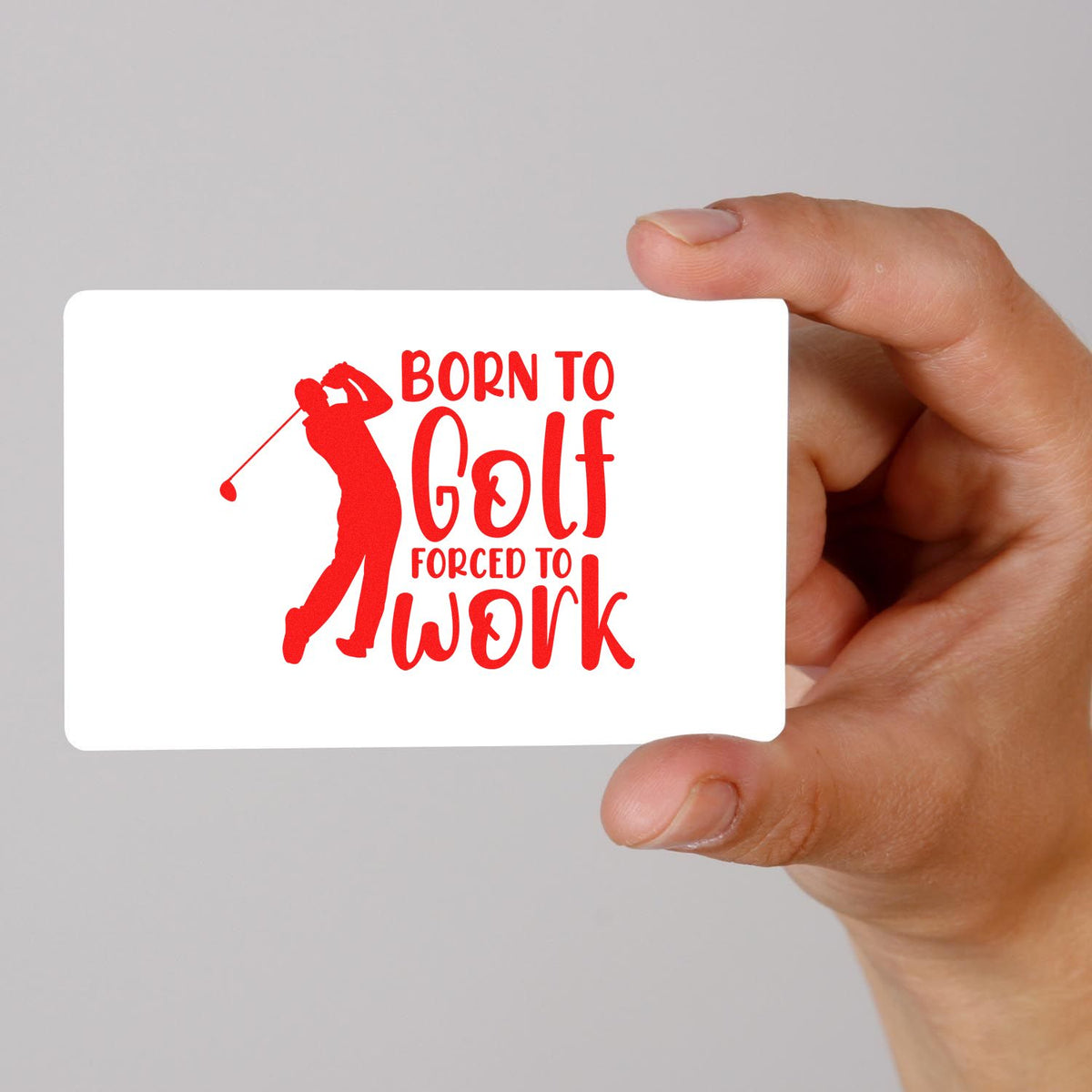Golf rubber stamp design with golfer silhouette and Born to Golf, Forced to Work slogan held in hand.