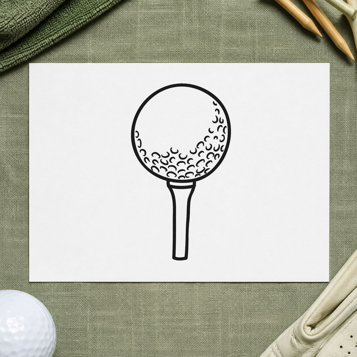 Golf Ball On Tee craft stamp in black ink on cardstock, an easy option for junior album page.