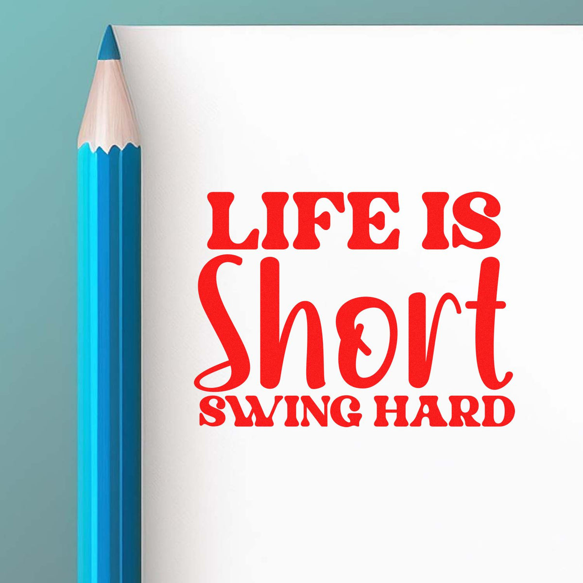 Custom rubber stamp design with quote Life is short, swing hard beside a pencil.
