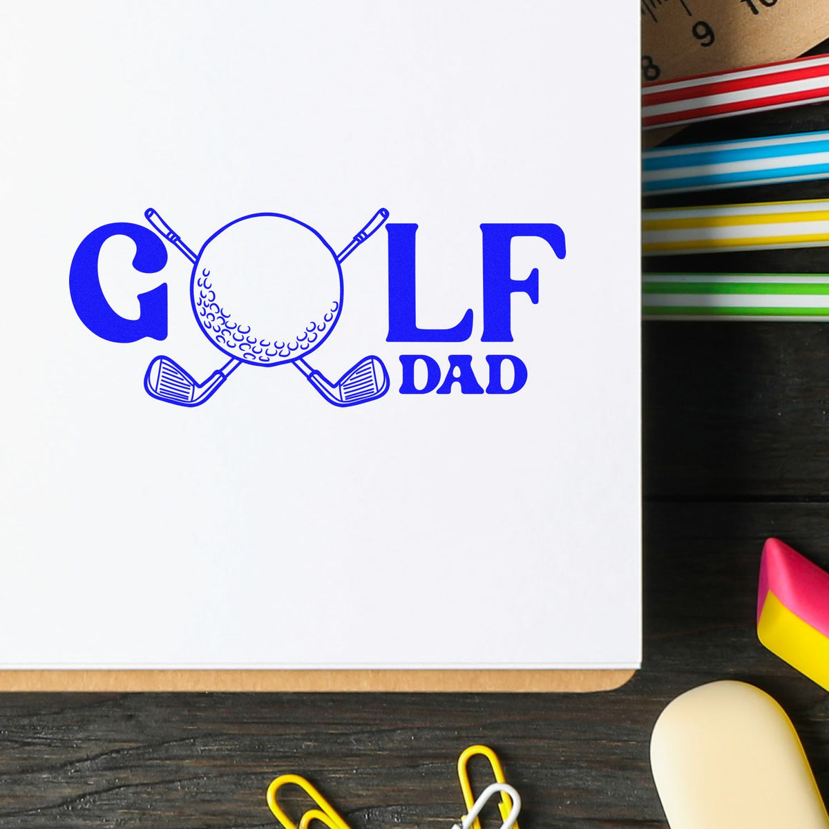 Custom Golf Dad rubber stamp impression with golf ball and clubs in blue ink on paper.