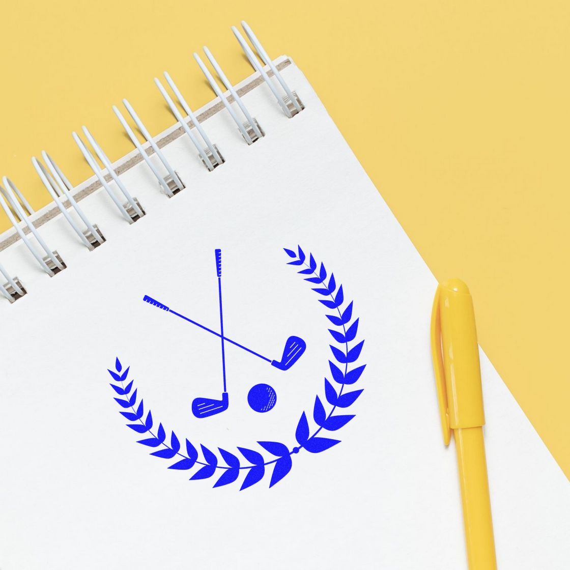 Custom golf rubber stamp with club and laurel wreath design on a notebook, ideal for branding stationery and packaging.