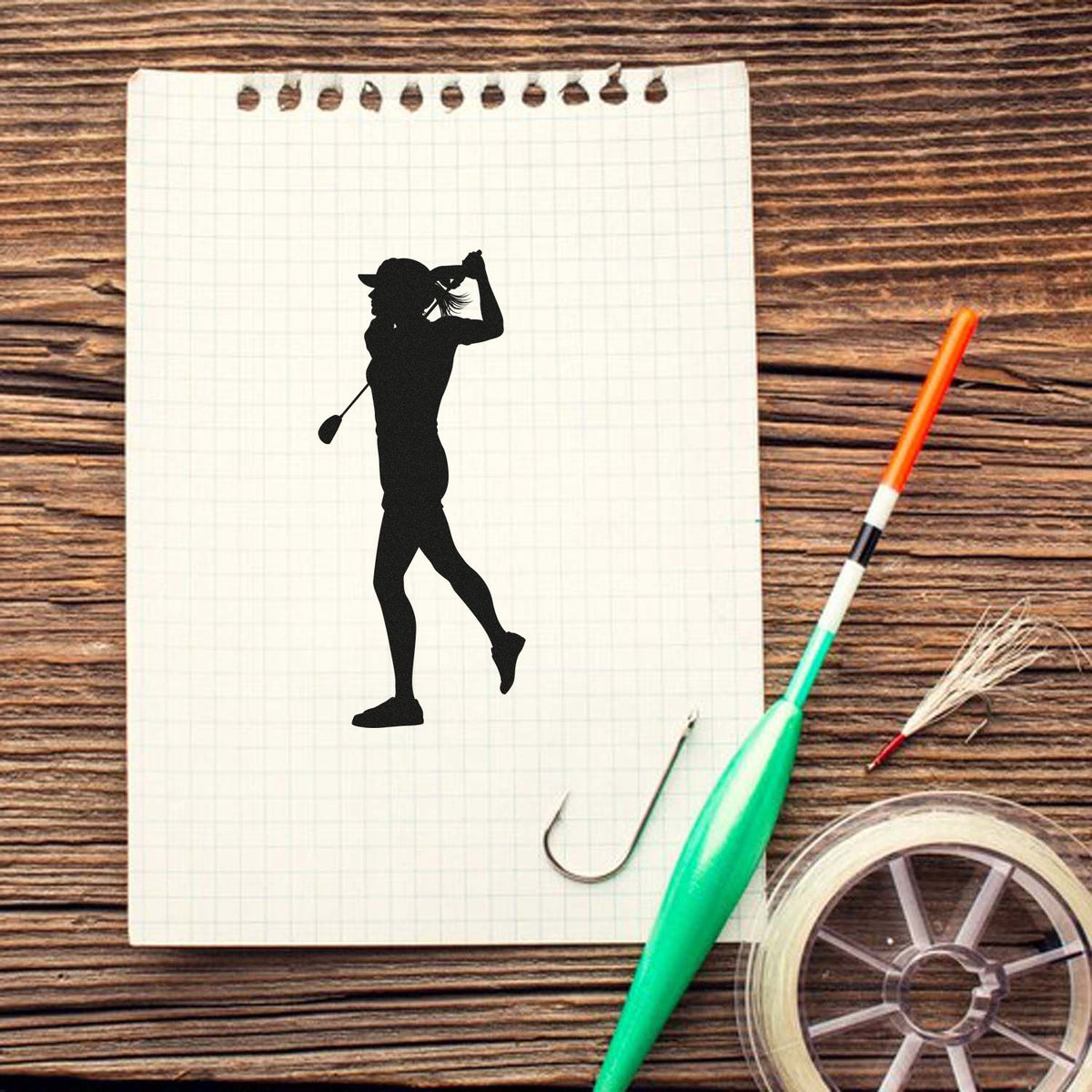Golf swing silhouette rubber stamp design on notebook for DIY card making, scrapbooking, and craft projects.