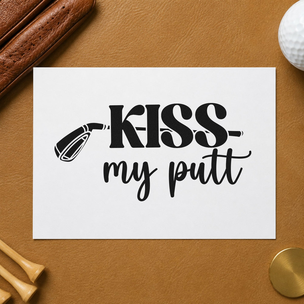 Kiss My Putt Club craft stamp imprint in black ink on a handmade project, one idea being turf roll gift tags.
