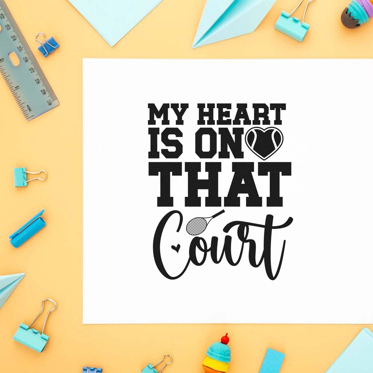 Tennis-themed rubber stamp design with My Heart Is on That Court text, heart and racket graphic.