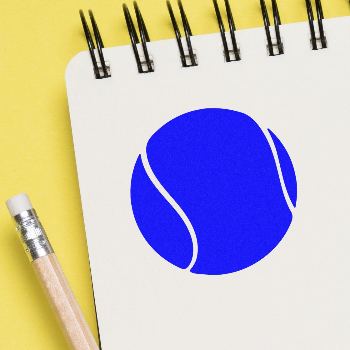 Custom rubber stamp logo mockup on notebook with pencil, ideal for stationery, branding, and promotional stamp design.
