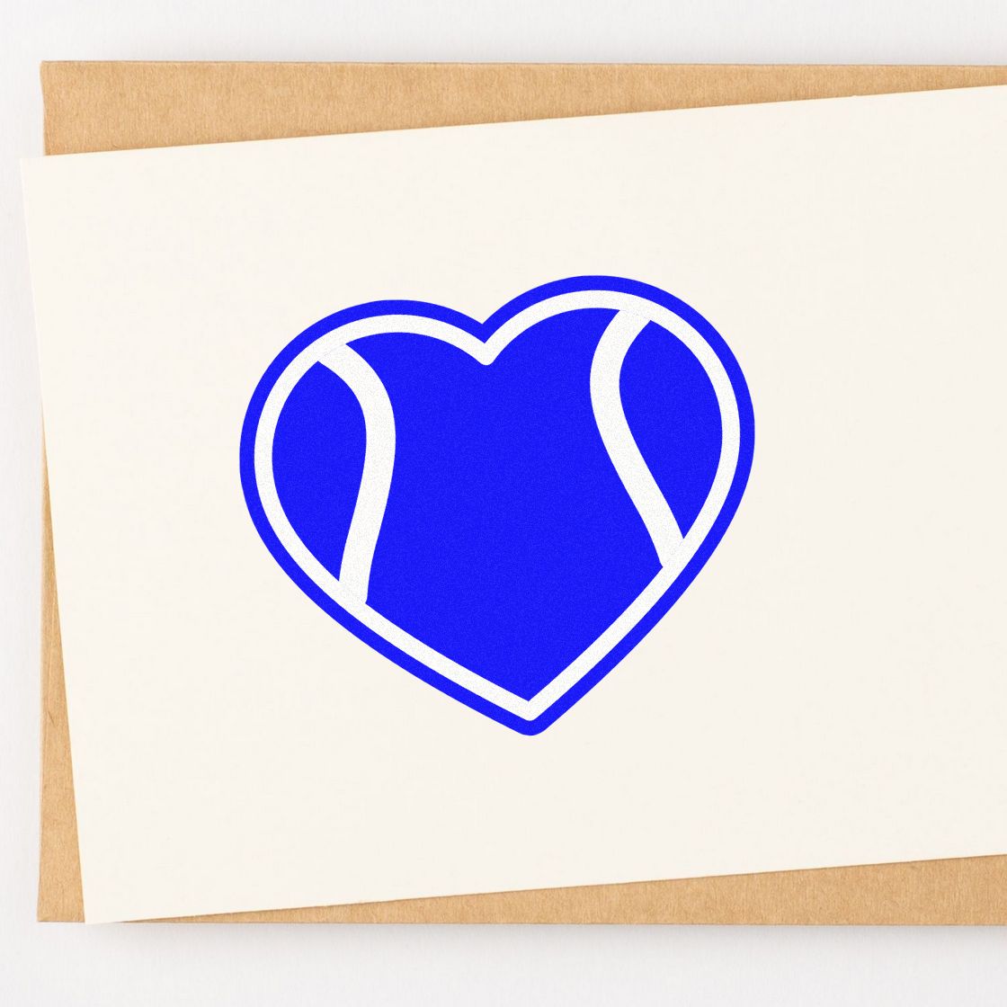 Blue heart logo rubber stamp design on white card for custom branding, stationery, and craft projects.