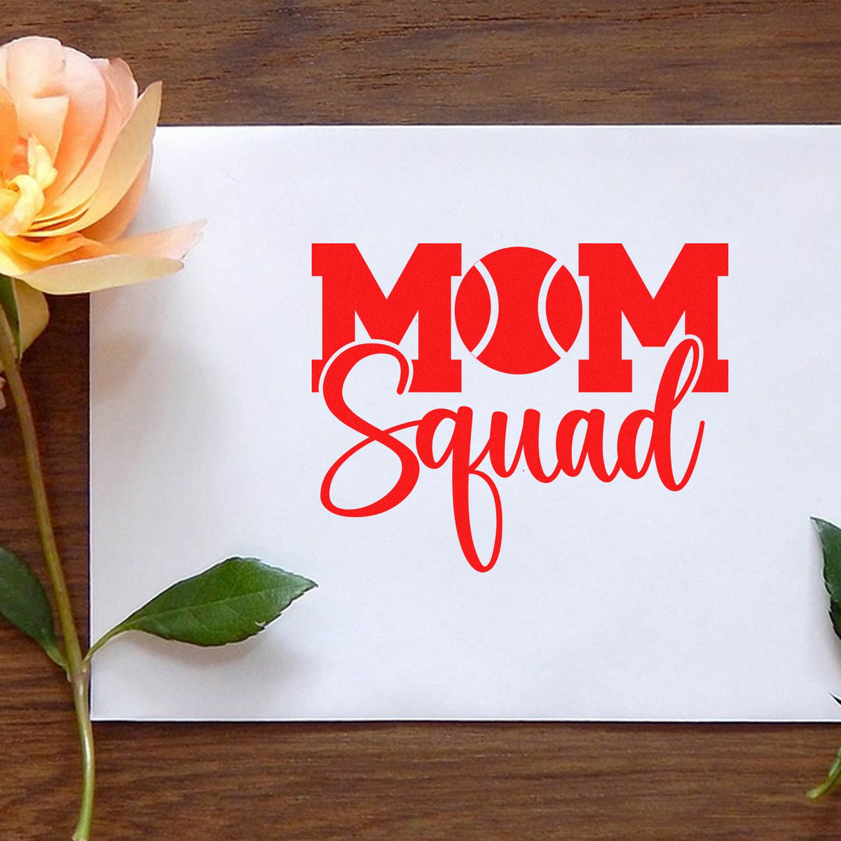 Custom Mom Squad rubber stamp design in red, styled on a greeting card with flowers for Mother's Day crafts.