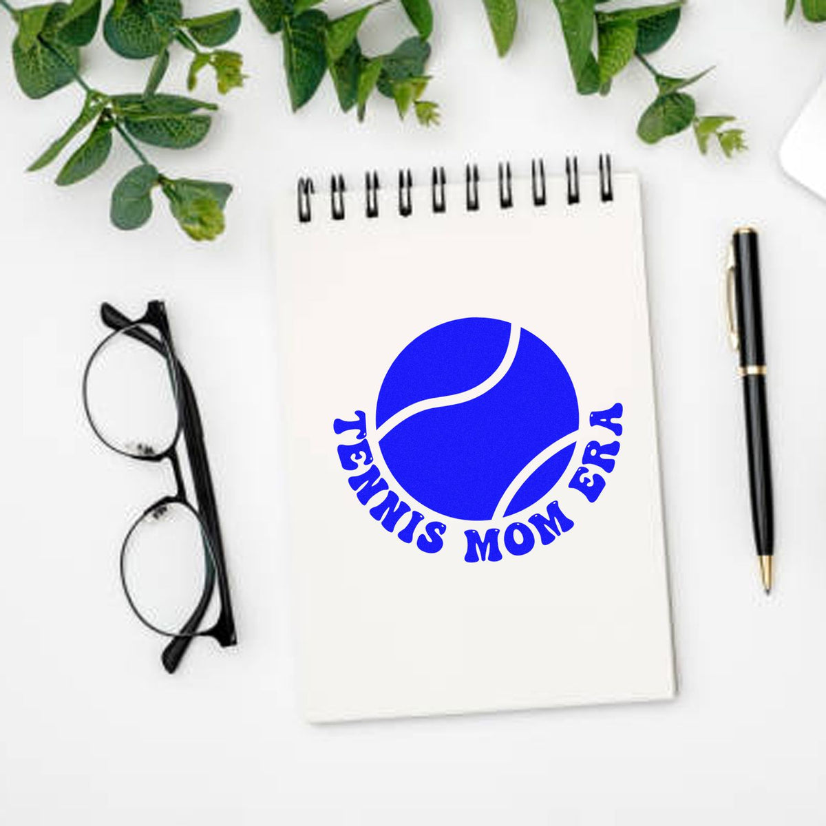 Custom Tennis Mom Era rubber stamp design with tennis ball graphic on notebook